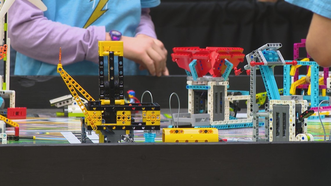 Hands building Lego