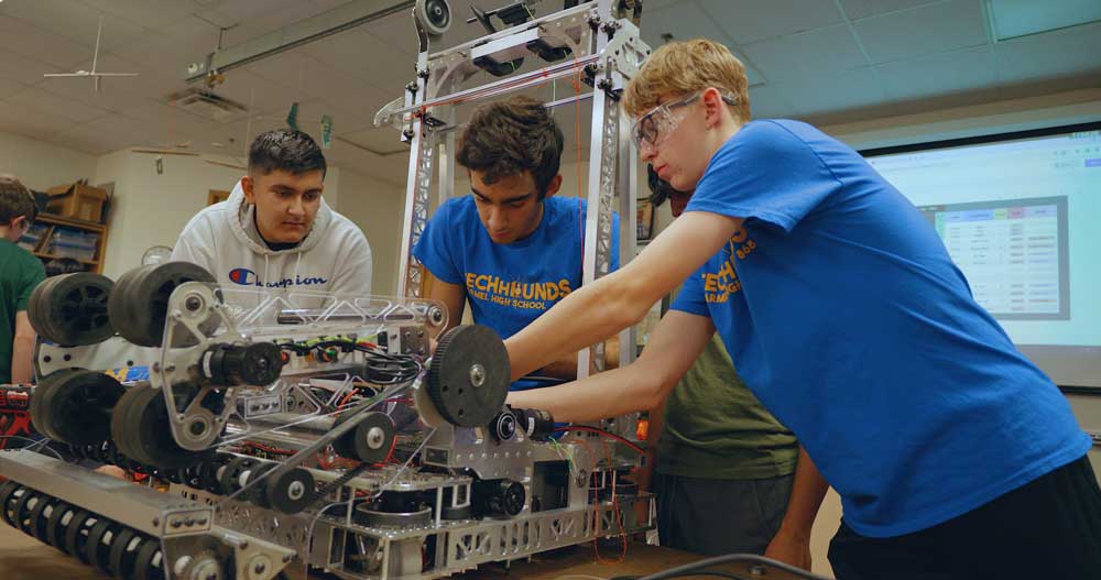 Kids working on robots
