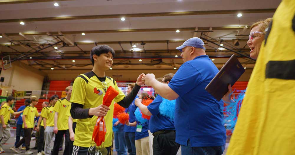 Fist bumping teams