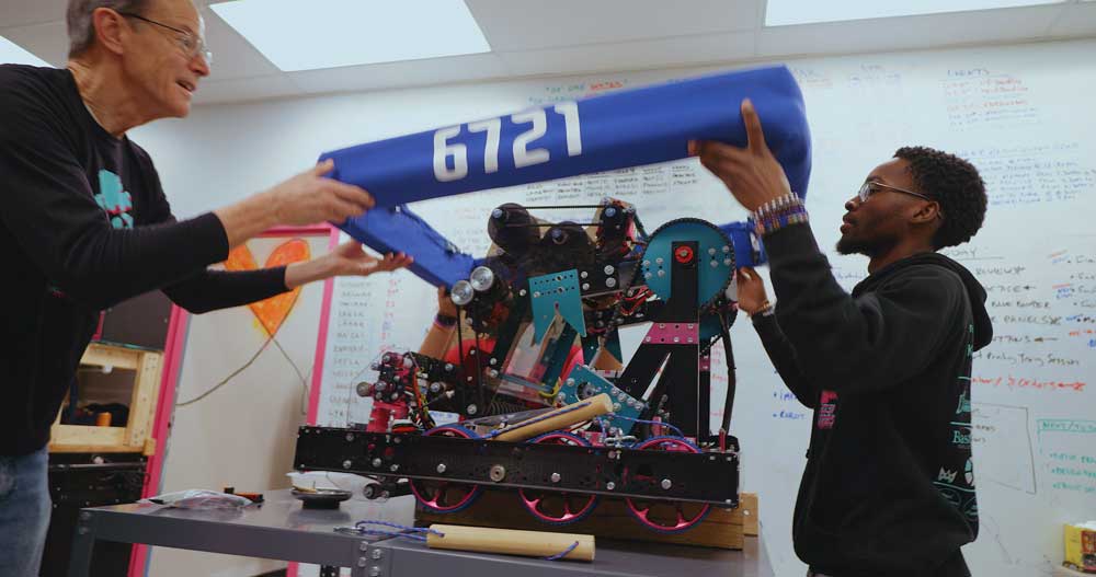 Adult and child building robot