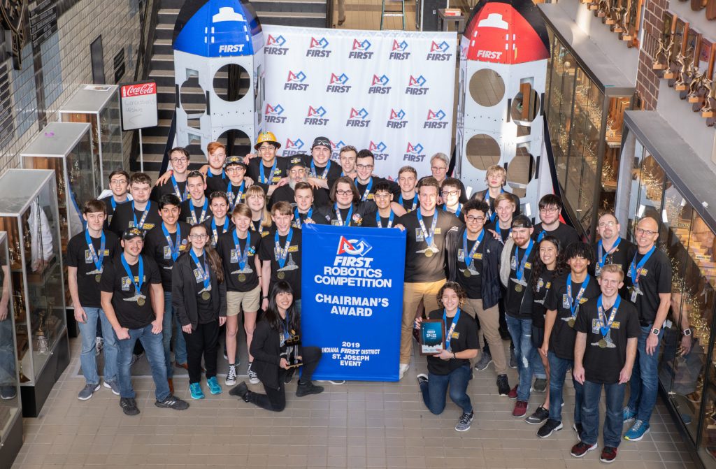 Competitors posing with their medals at an event